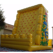 yellow inflatable climbing wall